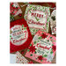 Image of the Gift bags, in green, red, and pink, with Christmas-y sayings and motifs 