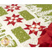 A super close up on the patchwork of the project, demonstrating fabric details and top quilting effects on the nine patch stars.