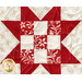 A top down shot of one of the nine patch stars, demonstrating fabric designs and top quilting details.