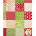 A head-on close up of the patchwork of the project, demonstrating fabric colors and print details.