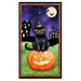 Fabric panel featuring a charming black cat, wearing a witch's hat, sitting on a pumpkin with haunted houses under a full moon.