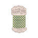 Spool of ivory fabric with an herb green gingham print bias tape isolated on a white background