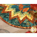 A super close up on the edge of the topper, demonstrating color and print details on the border and binding fabrics.