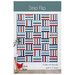 Cover of the Strip Flip pattern with a photo of the finished quilt.