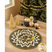 The completed Point of View Folded Star Table Topper colored in black, gold, and yellow fabrics from the Merry Christmas collection. The topper is staged on a wooden table with coordinating gold and black tableware.