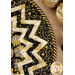 A very close up image of the outer edge of the topper, showcasing the prairie points and centerpiece fabric.