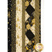 A super close up on the borders of the fabric, showing the various cream, black, and gold fabric prints.