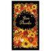 A black panel filled with fall foliage, pumpkins, and flowers with the words "Give Thanks" written in cursive in the center.  