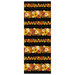 A black border stripe fabric with pumpkins, fall foliage, and scrolls. 