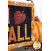 A stylized, angled shot of the wall hanging staged next to a decorative pumpkin.