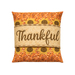 The finished Thankful pillow wrap kit, an orange and tan wrap with sunflower borders and appliqué letters that read 