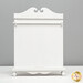 The small sized Quiltkeeper, a white decorative board with a scalloped top and a curved base, set against a gray background.