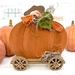 The fully assembled and painted Primitive Pumpkin Cross Stitch Display and Pumpkin Wagon Wood Décor, staged on a white tabletop.