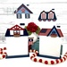 The fully assembled and painted Patriotic City House Cross Stitch Displays #1 - 4, staged on a white tabletop with coordinating patriotic décor and flowers.