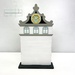 The fully assembled and painted City Clock Tower Cross Stitch Display Backer, staged on a white tabletop.