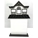 The fully assembled and painted City House #2 Cross Stitch Display Backer, staged on a white tabletop.