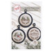 Front of pattern showing the completed cross stitch designs displayed on a white wooden slatted background with coordinating decor.