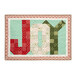 The completed Patchwork Holiday Joy project colored in red, cream, green, and aqua fabrics from the Sugarberry collection by Andover Fabrics, isolated on a white background.