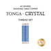 A spool of thread in icey blue, isolated on a white background underneath a text graphic that reads "60 Degree Diamond Table Topper - Tonga - Crystal Thread Set."