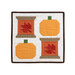 The completed Sew Thankful wall hanging, two spools with pieced leaves paired with two pieced pumpkins in bold autumn colors, isolated on a white background.