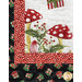 A shot of the lower left corner of the quilt, showcasing the adorable mushrooms and border fabric.