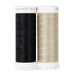 Two spools of black and ecru thread, isolated on a white background.