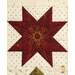 A super close up of the star on top of the tree, showcasing fabric, piecing, and top quilting details.