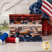 A stack of the fabrics included in the American Country collection, with flowers and a jar and a lantern and an American flag and thread.