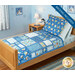 The views crib quilt in blue tones from the Snowfest collection staged on a wooden bed with coordinating winter décor. 