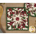 A stylized shot of the square hot pad, demonstrating details on the festive snowman fabrics.