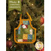 A completed Christmas Apron Ornament, colored in warm, saturated fabrics from the Star of Wonder - Star of Light collection by Benartex, hung on a decorated Christmas tree. A small chocolate Santa peeks out of the dimensional front pocket.