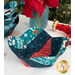 A closer look at the bowl cozies, showing details on the teal, navy, and red fabrics of the cozies, along with stitching details. Coordinating décor peeks into frame from the top.