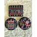 Three decorative cross stitched Christmas-themed items: a sign reading December and two circular images featuring a house and Santa.