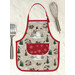 A completed Apron Casserole Hot Pad in winter themed fabrics beside a spatula and whisk.