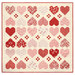 The completed Heartwarming Quilt colored in cream, pink, and red fabrics from the Letters to Cupid collection by Riley Blake Designs, isolated on a white background.