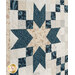 A close up on one of the patchwork blocks featuring a large star and four chains.