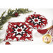 The completed Folded Star Hot Pad(s), shown in round and square options, colored in red, black, and white fabrics from the Blizzard Fun collection by Henry Glass Fabrics, staged with coordinating holiday and kitchen décor.