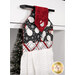 An angled close up at the top of the hanging towel, showing details on the black fabric with snowmen and red fabric tab.