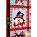 An angled shot of a snowman panel, demonstrating fabric and top stitching detail. 