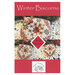 The front of the Winter Biscornu cross stitch pattern showing the completed project staged with coordinating decor.