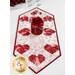 A shot of the table runner from a slight angle, showing the symmetry of the layout of the hearts. A red jar of coordinating roses sits in the center of the runner.