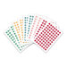 Sheets of colorful round labels featuring letters and numbers in various colors.