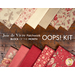 The fabrics included in the Joie de Vivre Patchwork BOM, fanned out in the red and cream colorways on a dark wood table; in between the rows of fabric, a text graphic reads "Joie de Vivre Patchwork Block of the Month Oops! Kit."