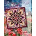 A vibrant quilt design titled Crimson Poppy features a kaleidoscopic floral pattern against a field of poppies.