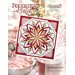 Brightly colored quilt pattern titled Peppermint Twist surrounded by festive holiday elements.