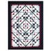 The Simply Terrific quilt by Pleasant Valley Creations in black, red, and green fabrics, isolated on a white background. 