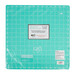 A light teal cutting mat with grid lines, labeled SELECT, wrapped in plastic.