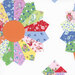 Scan of a cloud white fabric with a cheater quilt pattern featuring patterns from the collection