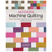 The front of Modern Machine Quilting book featuring a completed patchwork quilt with intricate quilting detail.