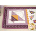 A close up on the purple basket patchwork on the end of the small table topper. 